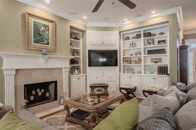 1589 Royal Forest Ct, Lakeland, FL 33811 - living area featuring ornamental molding, ceiling fan, built in features, a fireplace, and recessed lighting