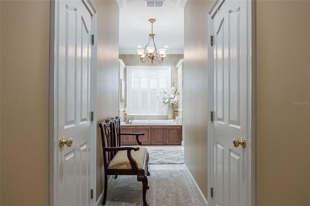 1589 Royal Forest Ct, Lakeland, FL 33811 - hall with a chandelier, crown molding, and carpet