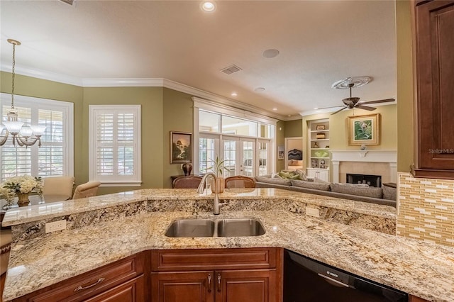 1589 Royal Forest Ct, Lakeland, FL 33811 - kitchen featuring dishwashing machine, ceiling fan, healthy amount of natural light, light stone countertops, and ornamental molding