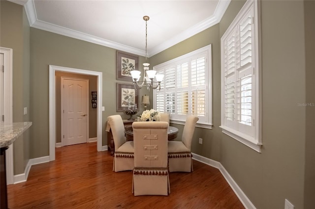 1589 Royal Forest Ct, Lakeland, FL 33811 - dining room with ornamental molding, wood finished floors, and a chandelier