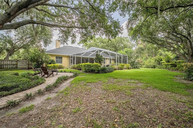 1589 Royal Forest Ct, Lakeland, FL 33811 - back of property with a chimney and a lanai