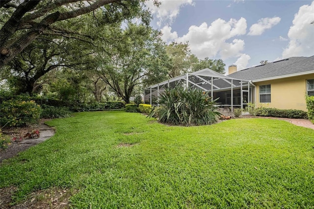 1589 Royal Forest Ct, Lakeland, FL 33811 - view of grassy yard featuring a lanai