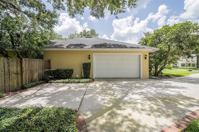1589 Royal Forest Ct, Lakeland, FL 33811 - view of home's exterior with stucco siding, driveway, and a garage