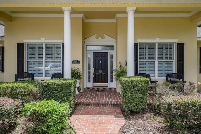 1589 Royal Forest Ct, Lakeland, FL 33811 - doorway to property featuring stucco siding and a porch