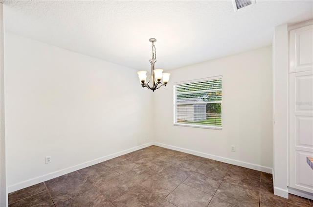 6507 Shadowbrook Run, Lakeland, FL 33813 - spare room with a chandelier and baseboards