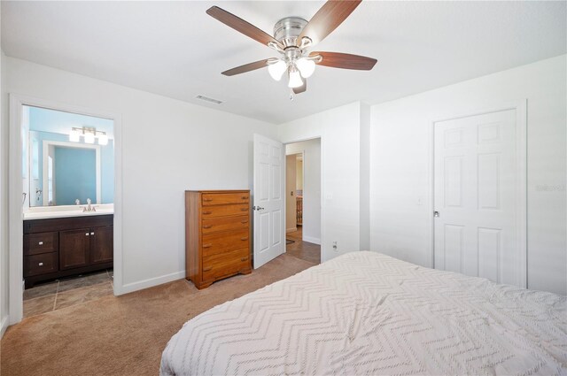 6507 Shadowbrook Run, Lakeland, FL 33813 - bedroom featuring light colored carpet, ensuite bath, and ceiling fan