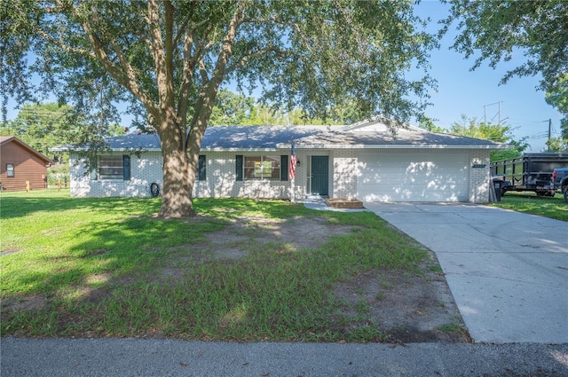6507 Shadowbrook Run, Lakeland, FL 33813 - ranch-style home with a garage, a front lawn, brick siding, and concrete driveway