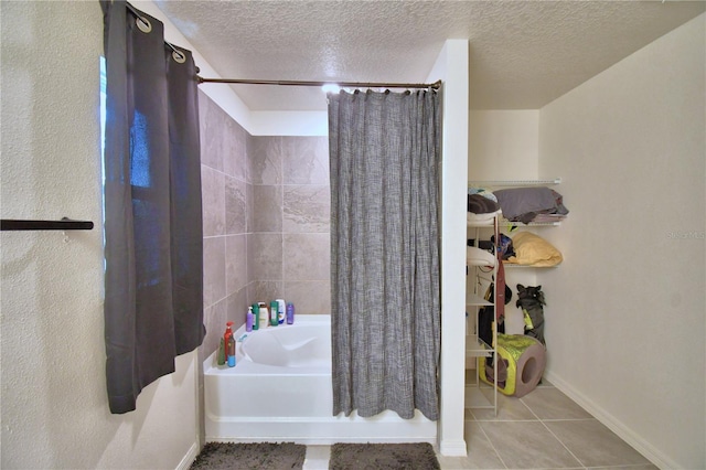312 Walnut Ln, Auburndale, FL 33823 - bathroom featuring shower / bathtub combination with curtain, tile patterned flooring, and a textured ceiling
