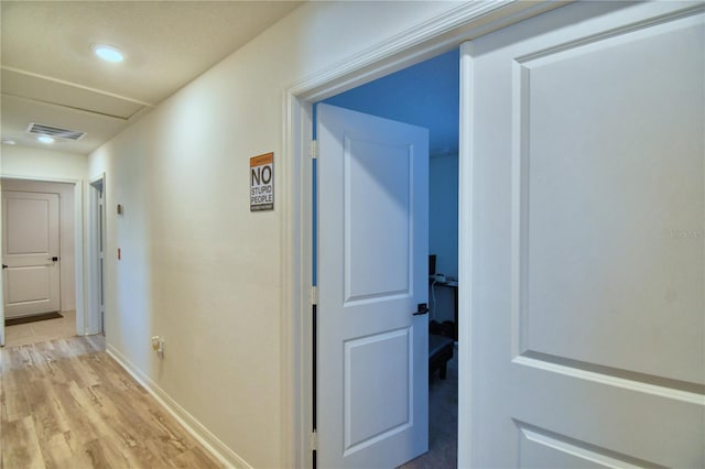 312 Walnut Ln, Auburndale, FL 33823 - hall featuring light wood-style flooring and attic access