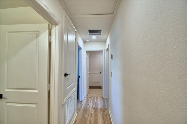 312 Walnut Ln, Auburndale, FL 33823 - hall with light wood-type flooring and a textured wall
