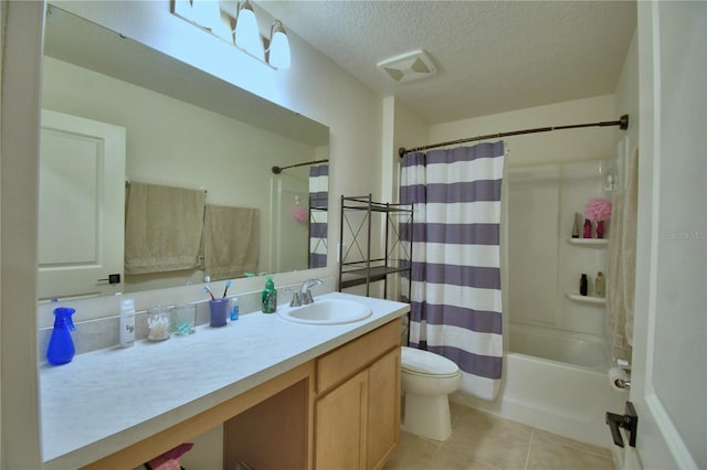 312 Walnut Ln, Auburndale, FL 33823 - full bath with tile patterned flooring, vanity, a textured ceiling, and shower / tub combo