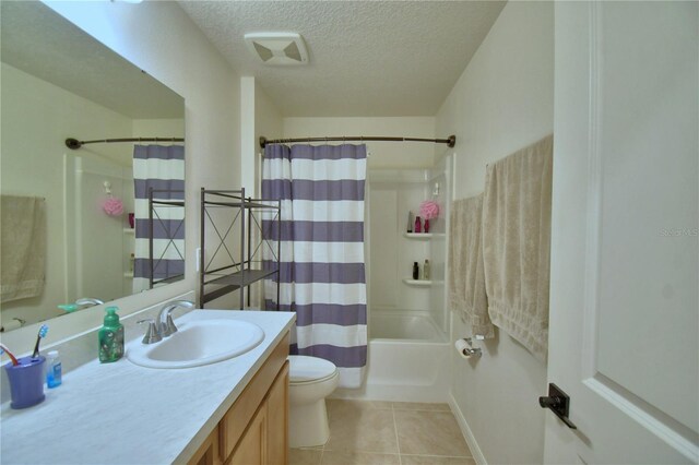 312 Walnut Ln, Auburndale, FL 33823 - full bath featuring vanity, a textured ceiling, tile patterned flooring, and shower / tub combo