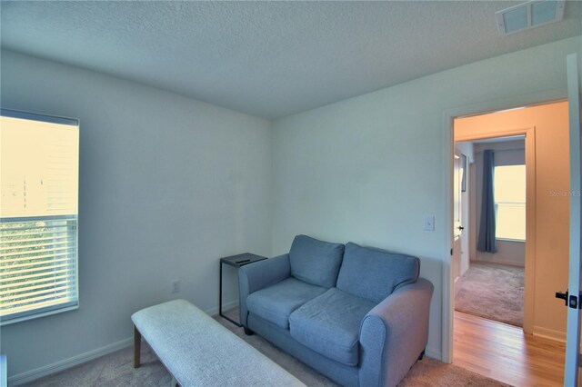 312 Walnut Ln, Auburndale, FL 33823 - sitting room featuring a textured ceiling