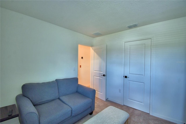 312 Walnut Ln, Auburndale, FL 33823 - living room featuring carpet floors and a textured ceiling