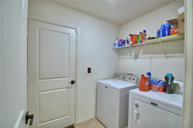 312 Walnut Ln, Auburndale, FL 33823 - laundry room featuring independent washer and dryer and light tile patterned floors