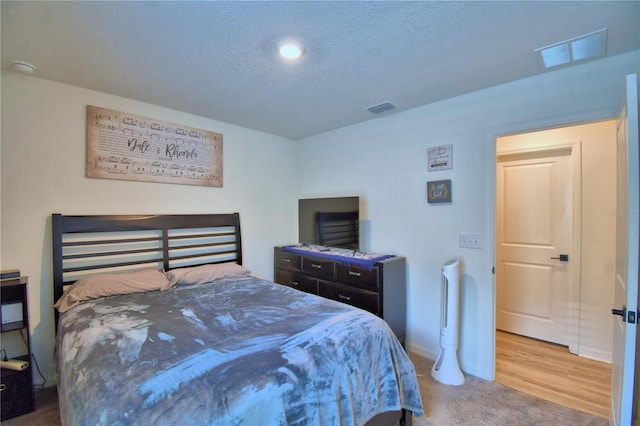 312 Walnut Ln, Auburndale, FL 33823 - carpeted bedroom featuring a textured ceiling and recessed lighting