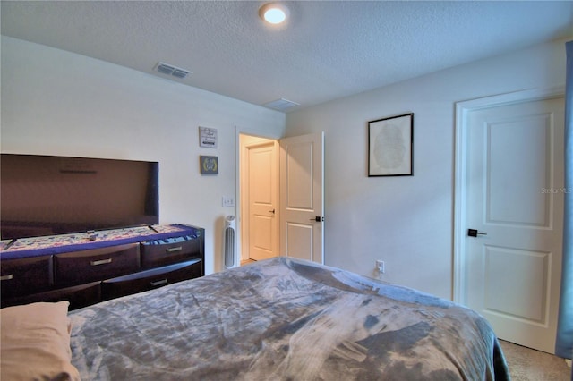 312 Walnut Ln, Auburndale, FL 33823 - bedroom with a textured ceiling and carpet flooring