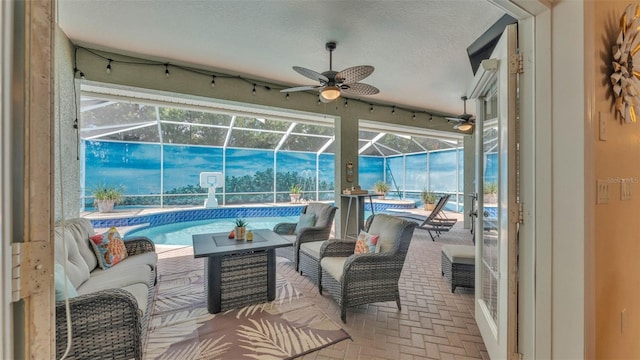 2817 High Winds Ln, Lakeland, FL 33813 - view of patio with ceiling fan, an outdoor pool, glass enclosure, and an outdoor hangout area
