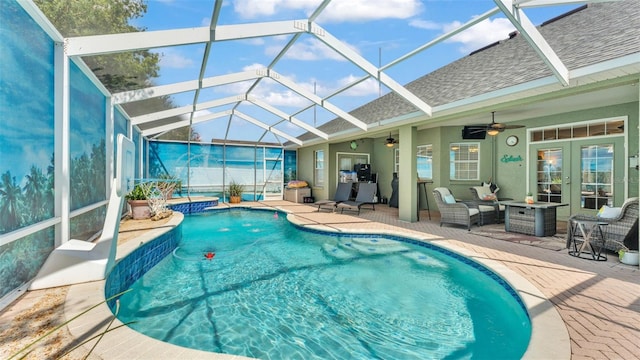 2817 High Winds Ln, Lakeland, FL 33813 - outdoor pool featuring a jacuzzi, french doors, a patio area, a ceiling fan, and a lanai
