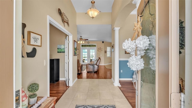 2817 High Winds Ln, Lakeland, FL 33813 - tiled foyer entrance featuring decorative columns and a ceiling fan
