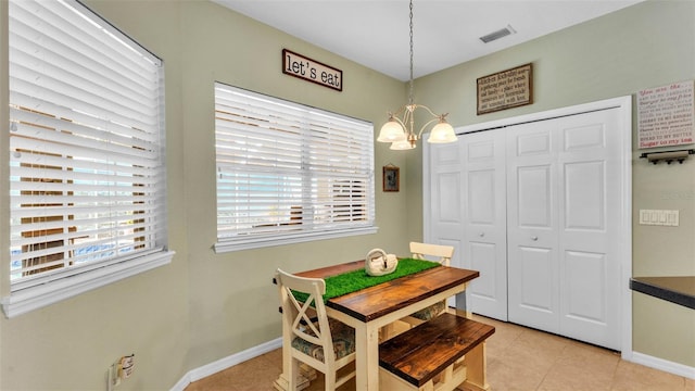 2817 High Winds Ln, Lakeland, FL 33813 - dining space with a chandelier and light tile patterned floors