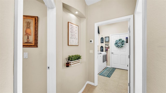 2817 High Winds Ln, Lakeland, FL 33813 - corridor featuring light tile patterned flooring and baseboards