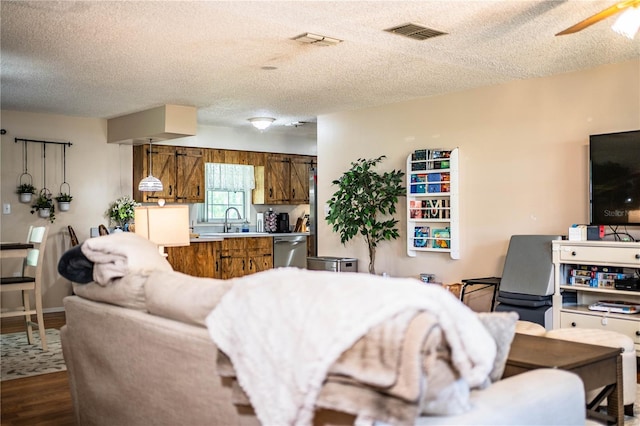 6920 Newman Cir E, Lakeland, FL 33811 - living room with dark wood finished floors, a textured ceiling, and a ceiling fan