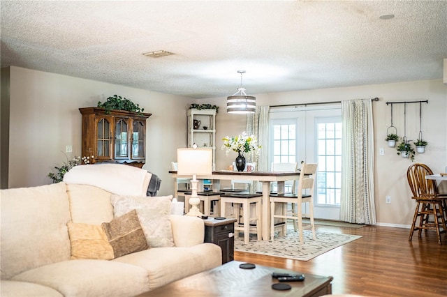 6920 Newman Cir E, Lakeland, FL 33811 - living room with wood finished floors and a textured ceiling