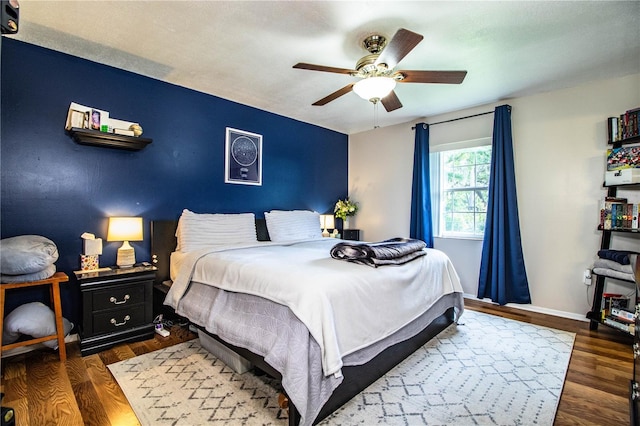 6920 Newman Cir E, Lakeland, FL 33811 - bedroom with wood finished floors and ceiling fan