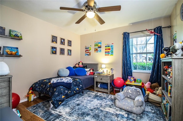 6920 Newman Cir E, Lakeland, FL 33811 - bedroom with wood finished floors and ceiling fan