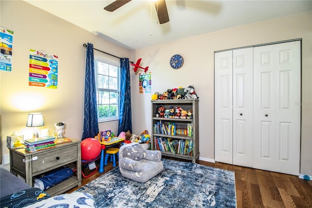 6920 Newman Cir E, Lakeland, FL 33811 - bedroom with a closet, a ceiling fan, and wood finished floors