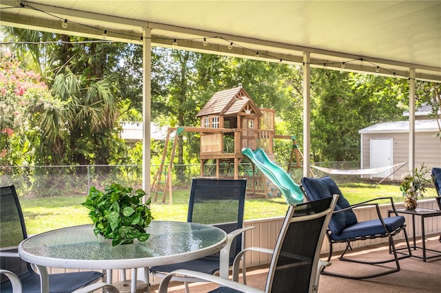 6920 Newman Cir E, Lakeland, FL 33811 - sunroom / solarium with outdoor dining space