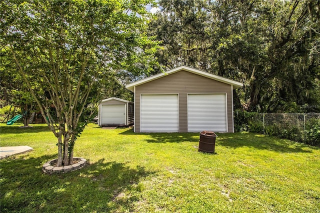6920 Newman Cir E, Lakeland, FL 33811 - detached garage featuring a storage shed