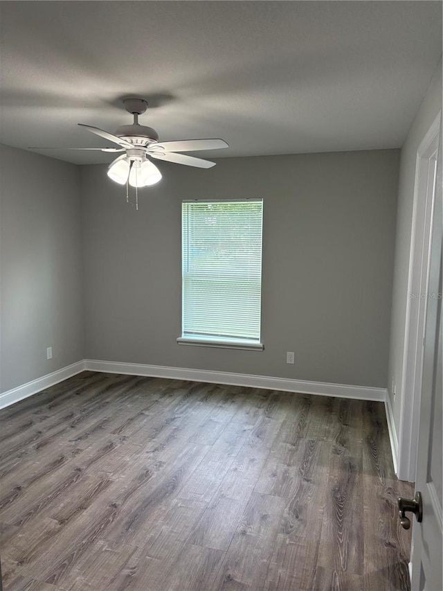 508 2nd St SW, Fort Meade, FL 33841 - unfurnished room featuring dark wood-type flooring and a ceiling fan
