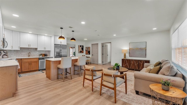 3235 Sandpiper Ln, Mulberry, FL 33860 - living room with light wood-type flooring and recessed lighting