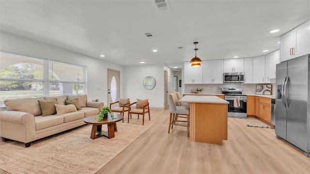 3235 Sandpiper Ln, Mulberry, FL 33860 - living room featuring recessed lighting and light wood-type flooring