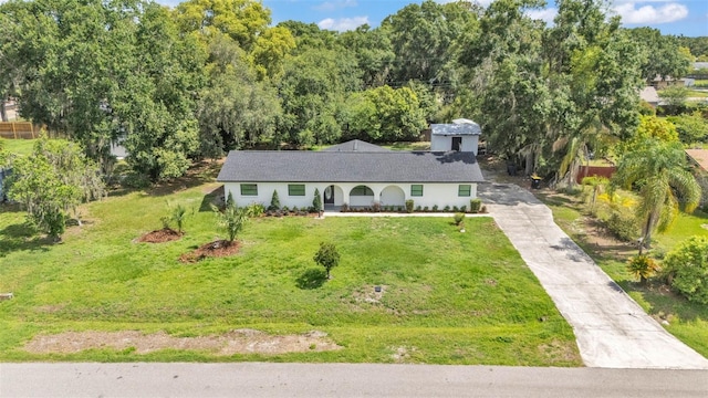 3235 Sandpiper Ln, Mulberry, FL 33860 - single story home with a front yard, concrete driveway, and a porch