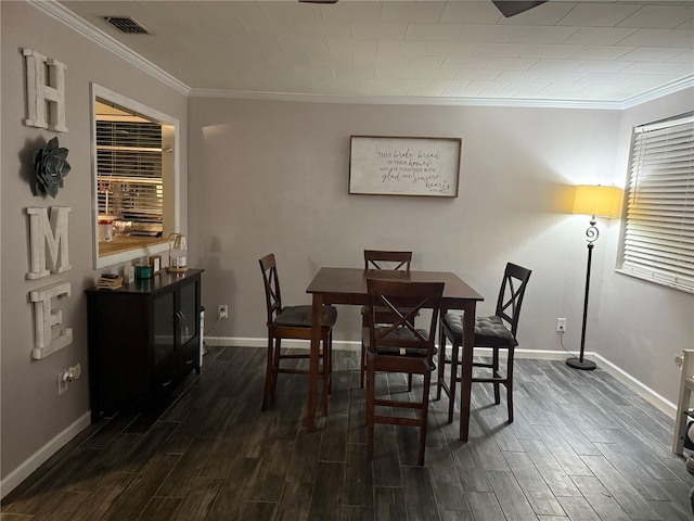 4818 Huron St, Zephyrhills, FL 33541 - dining space with crown molding and dark wood-type flooring
