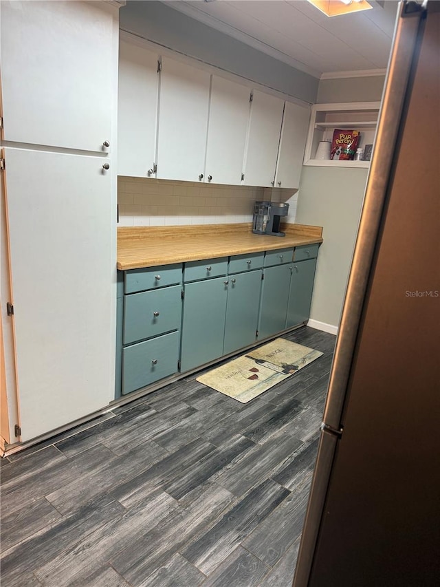 4818 Huron St, Zephyrhills, FL 33541 - kitchen featuring ornamental molding, tasteful backsplash, dark wood-style flooring, light countertops, and open shelves