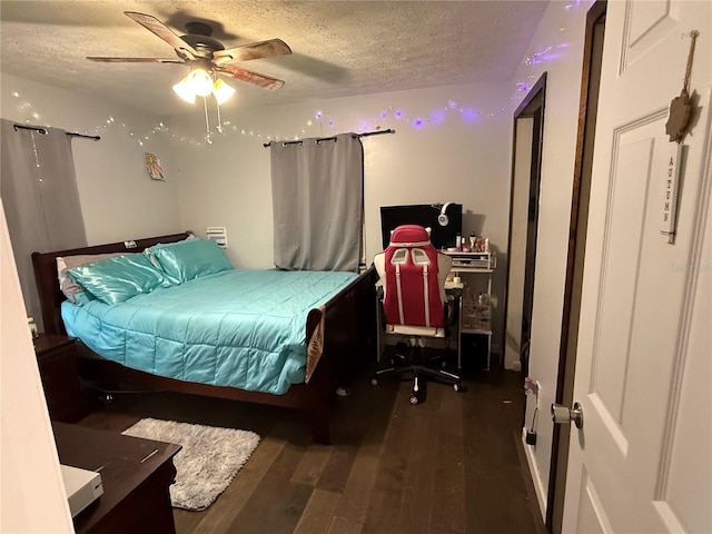 4818 Huron St, Zephyrhills, FL 33541 - bedroom featuring a textured ceiling, wood finished floors, ceiling fan, and a desk