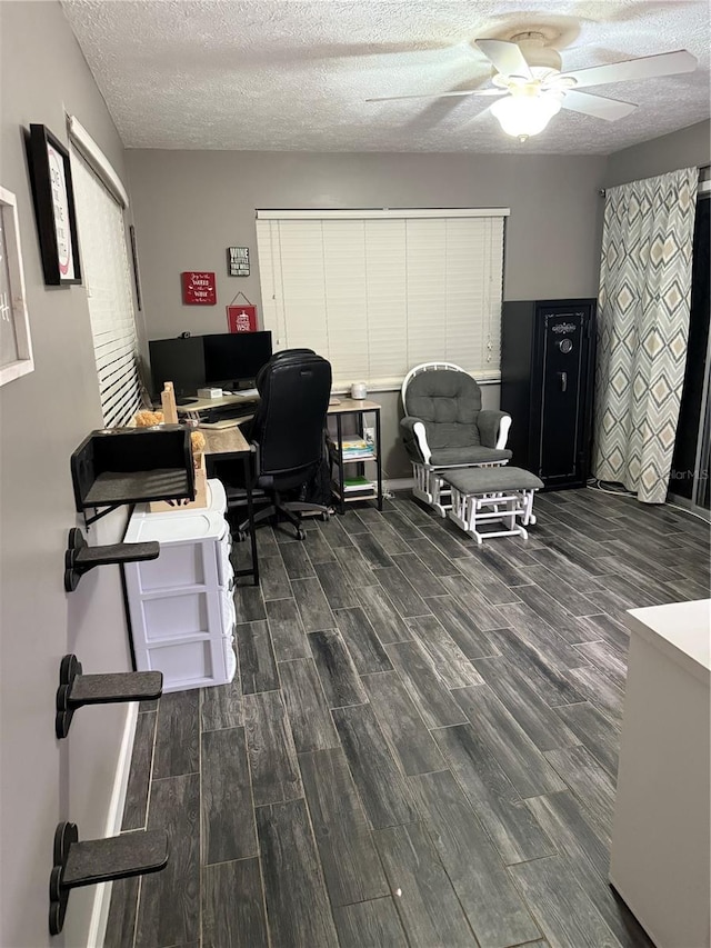 4818 Huron St, Zephyrhills, FL 33541 - home office featuring dark wood-type flooring, ceiling fan, and a textured ceiling