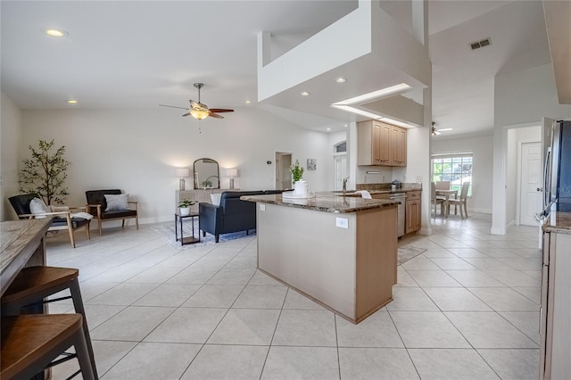2714 Highlands Vue Pkwy, Lakeland, FL 33813 - kitchen featuring open floor plan, ceiling fan, stone counters, light tile patterned floors, and recessed lighting