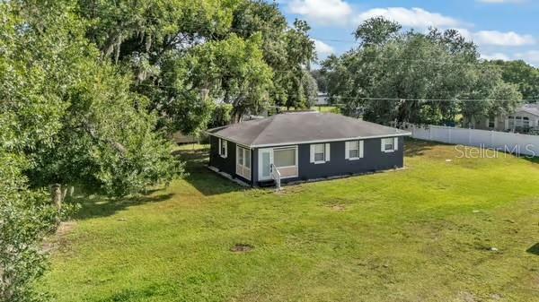 1050 Reynolds Rd, Lakeland, FL 33801 - view of home's exterior featuring view of scattered trees