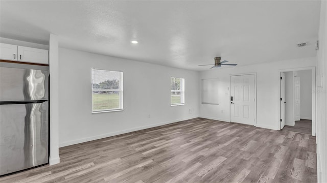 1050 Reynolds Rd, Lakeland, FL 33801 - unfurnished living room with a ceiling fan, light wood finished floors, and recessed lighting