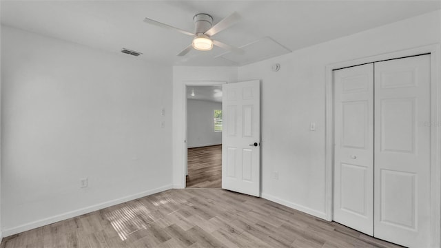 1050 Reynolds Rd, Lakeland, FL 33801 - unfurnished bedroom featuring light wood-style flooring, a closet, and a ceiling fan