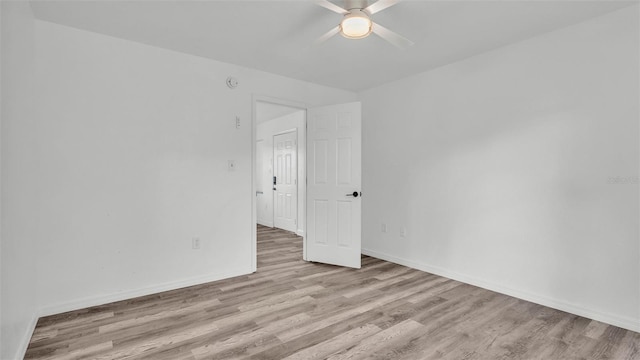 1050 Reynolds Rd, Lakeland, FL 33801 - unfurnished room featuring a ceiling fan, wood finished floors, and a smoke detector