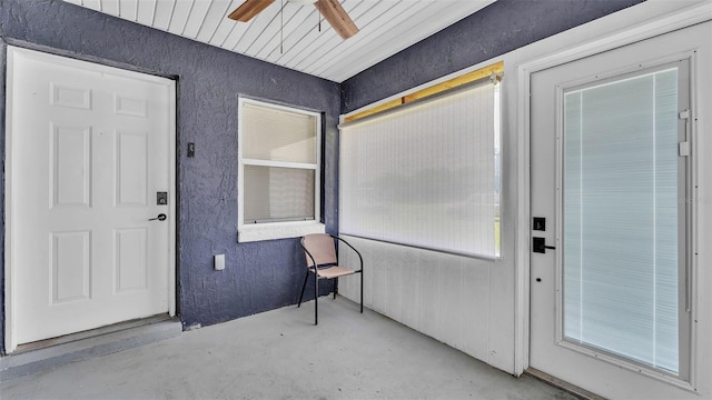1050 Reynolds Rd, Lakeland, FL 33801 - doorway to property featuring a ceiling fan and stucco siding