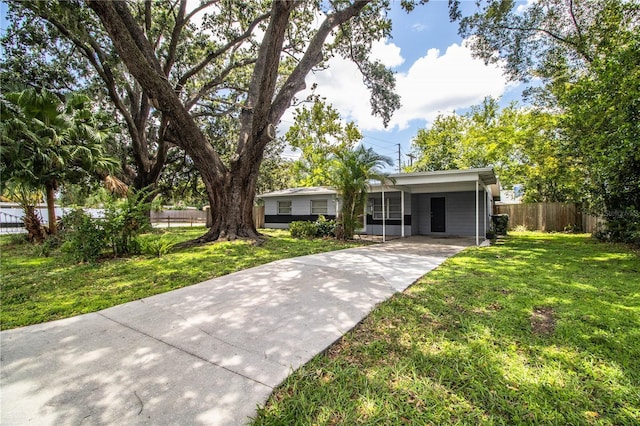 1604 Park Dr, Lakeland, FL 33803 - ranch-style home with concrete driveway and a carport
