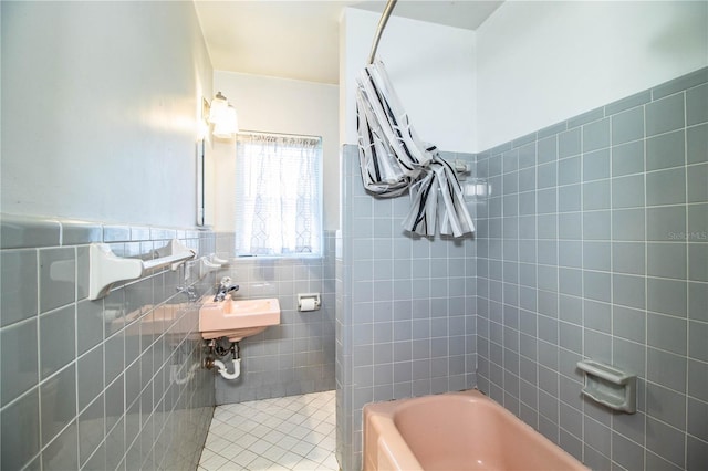 1604 Park Dr, Lakeland, FL 33803 - bathroom featuring tile walls, tile patterned floors, and wainscoting