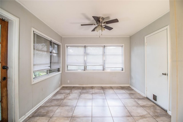 1604 Park Dr, Lakeland, FL 33803 - empty room featuring crown molding, ceiling fan, and light tile patterned floors